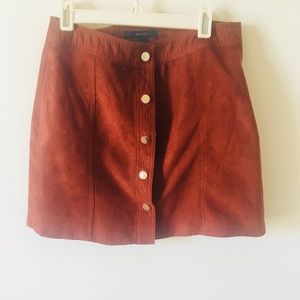 Suede burn orange skirt.